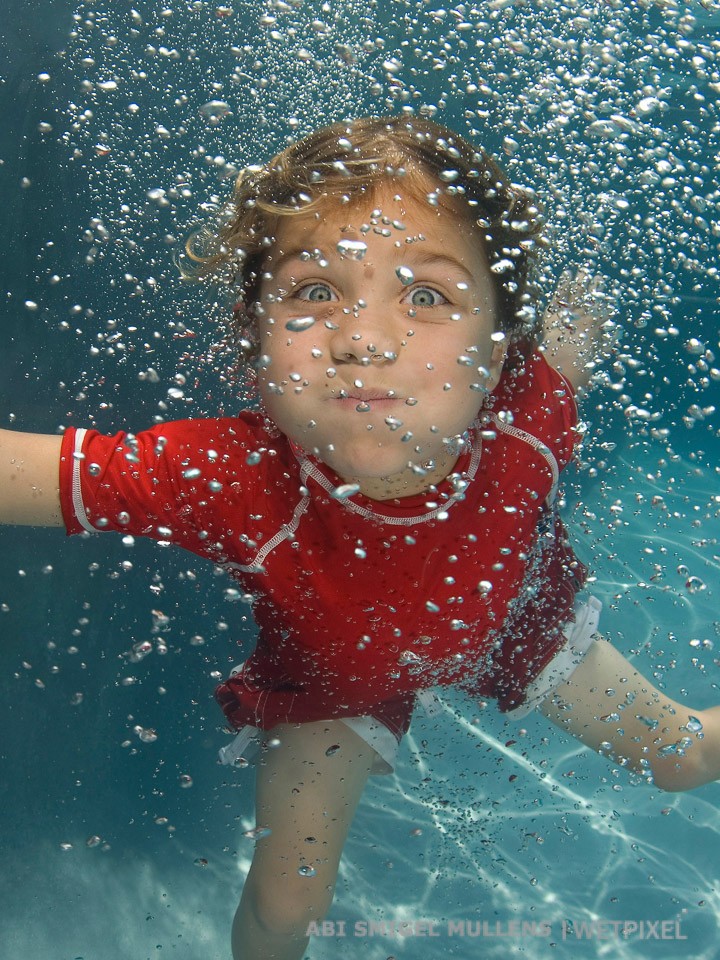 A carbonated kid, peeking through the bubbles.