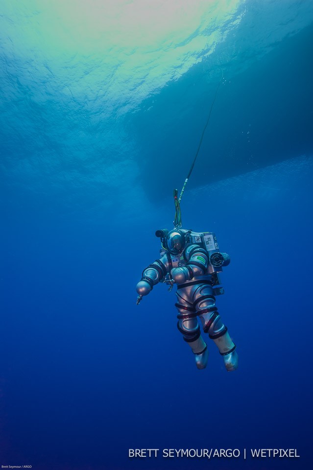 The Exosuit descends into the waters of Antikythera Greece.