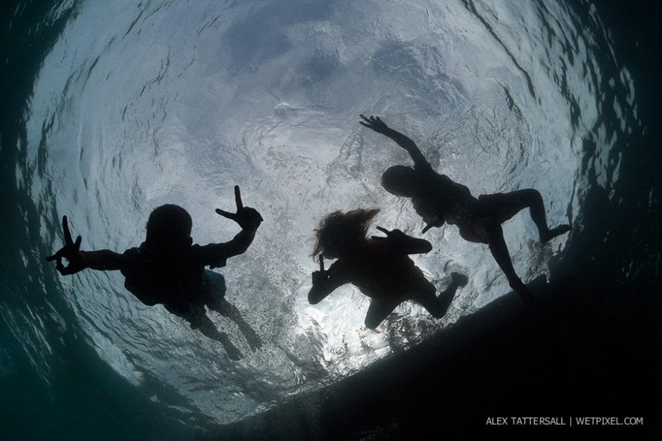 The children of Arborek Island. We arrived at Arborek jetty and conditions were not so good, torrential rain and poor vis, but the children were happily playing and jumping off the jetty for us. Nauticam NA-D750, Sigma 15mm.