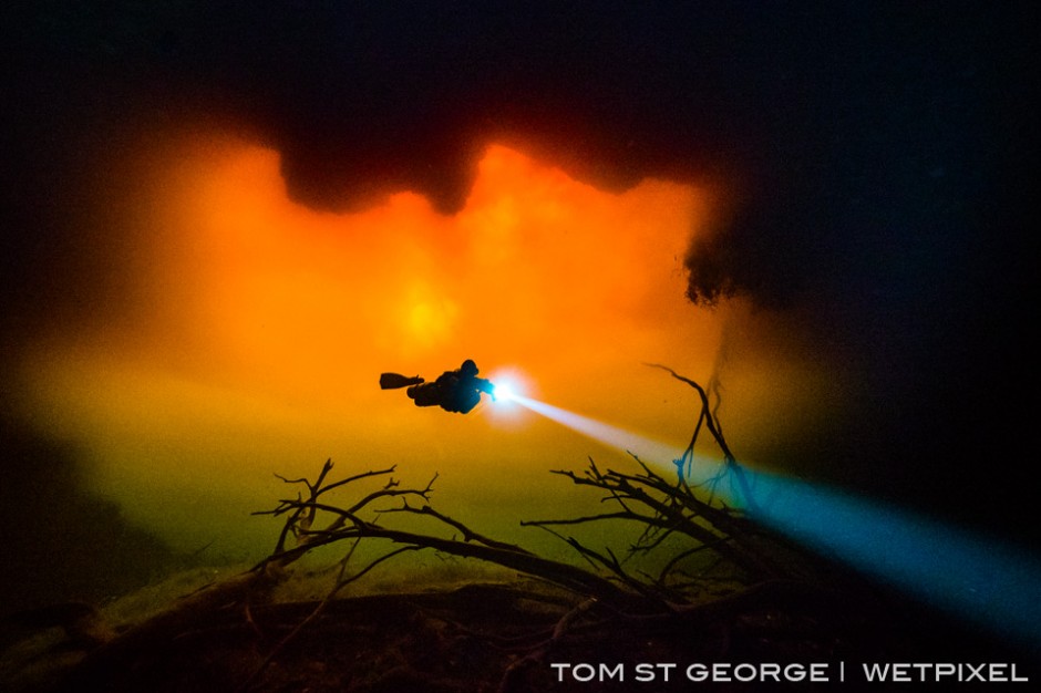 Occassionaly heavy rains wash tannic water into Cenote Carwash turning the whole cenote a fiery red.