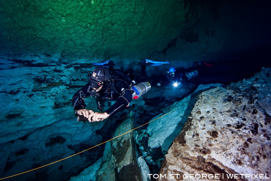 Above the halocline at Cenote Calavera. The saltwater and freshwater stain the cavern walls different colours.