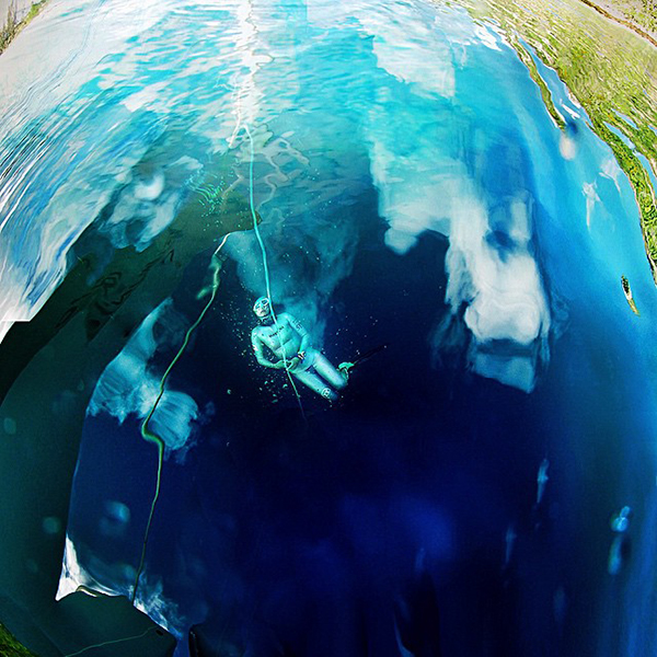 Freediver beneath the surface on Wetpixel